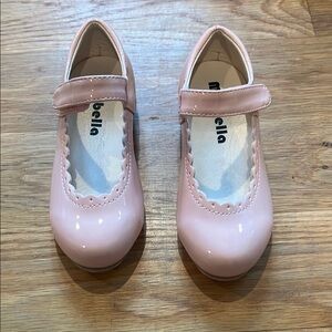 Pink tap dance shoes with removable bow